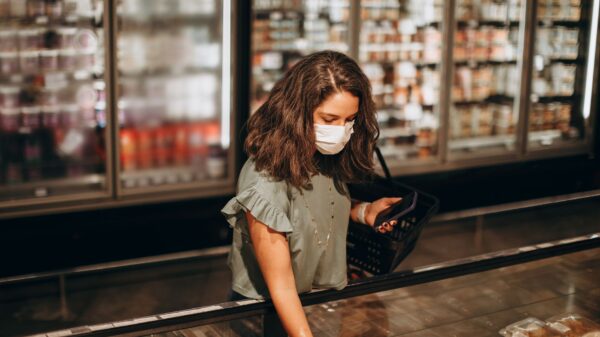 Best freezer alarm: a shopper at a supermarket freezer