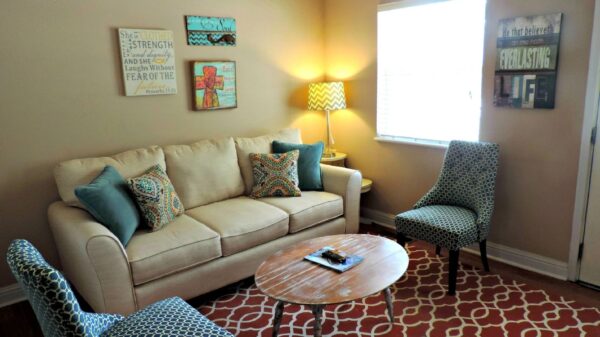 Best furniture sliders: a sofa and chairs on a patterned rug