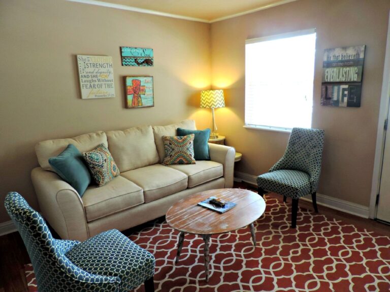 Best furniture sliders: a sofa on a rug in a living room