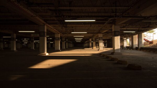 Best garage floor mat: a dim parking garage with concrete floors