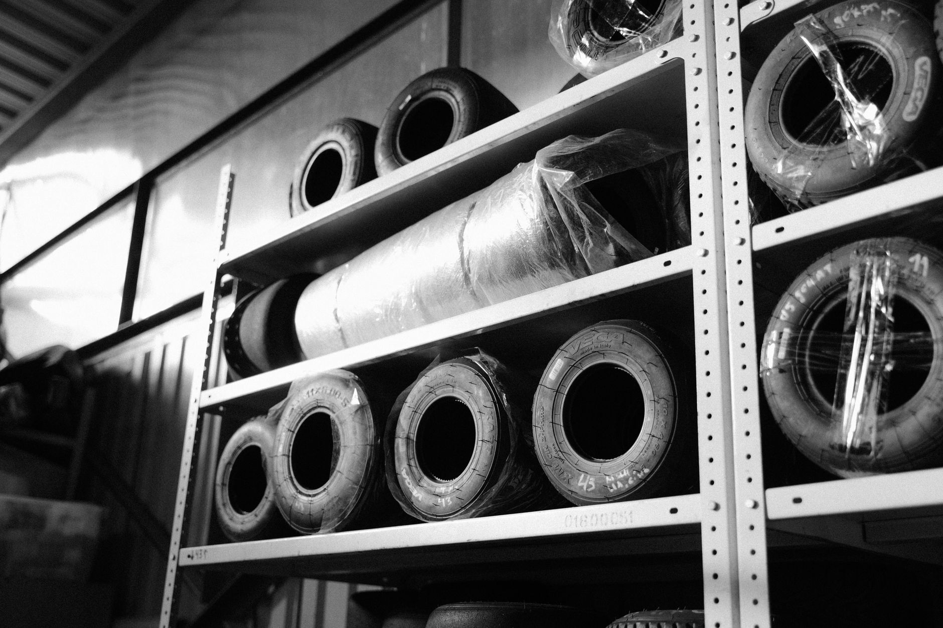 Tires stored on metal shelving