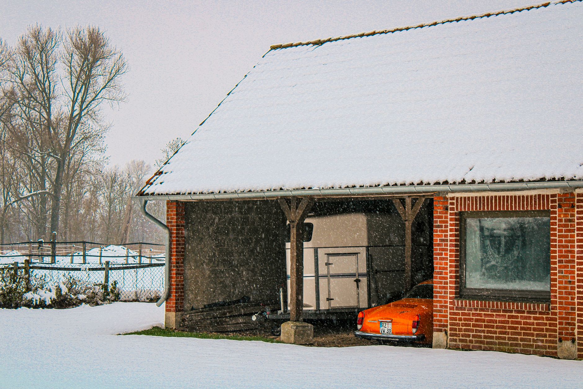 A house and garage in winter snow