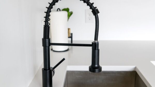 Best garbage disposal: a black pull-down faucet over a sink