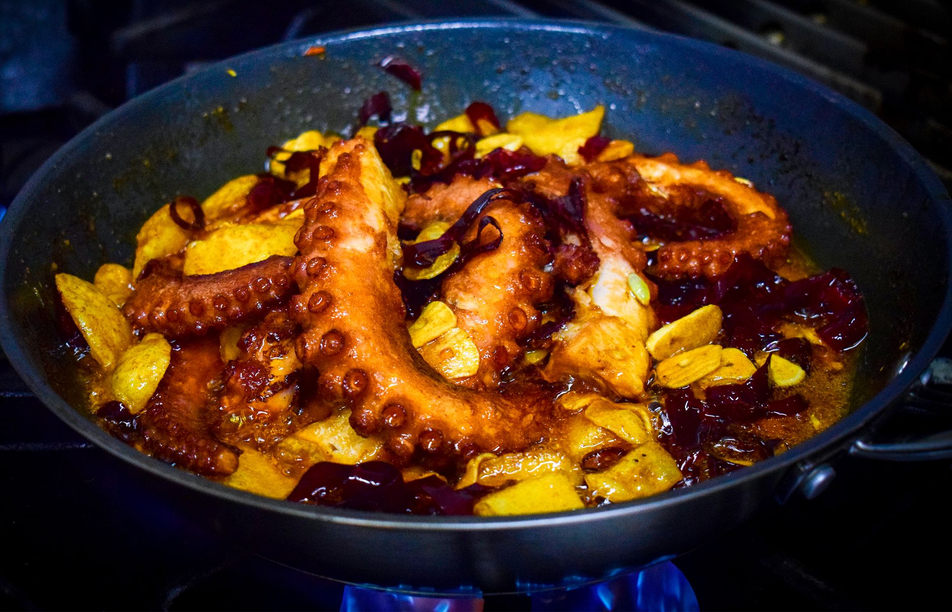 A stew simmering in a pan on the stove