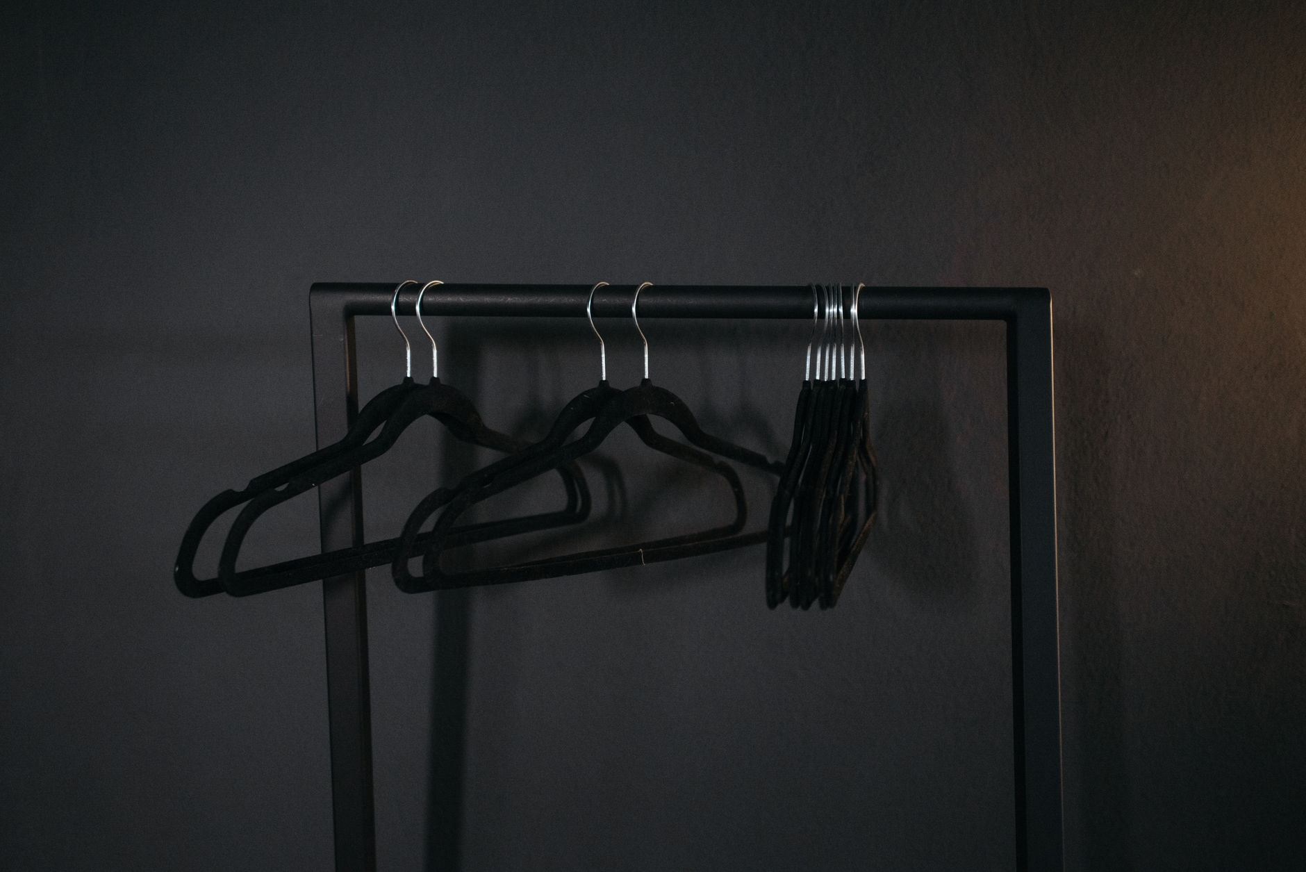 Clothes on hangers on a metal rack