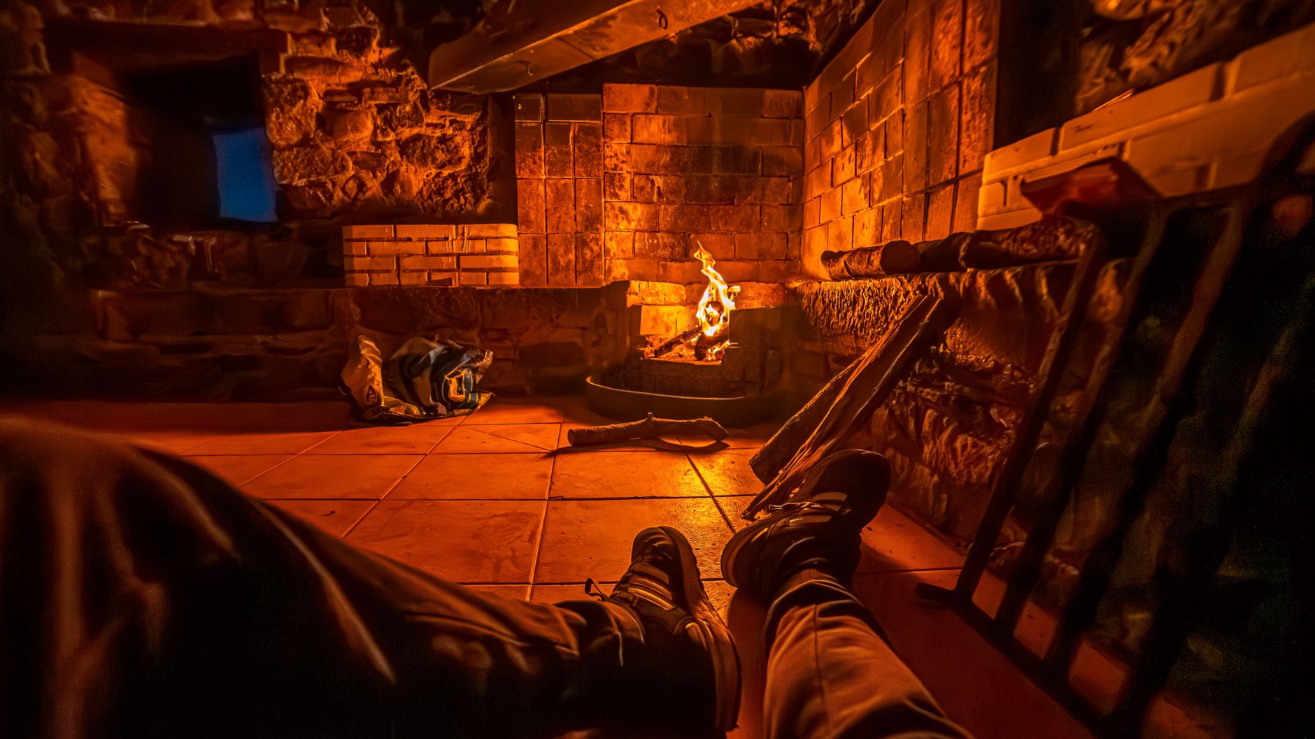 Relaxing by a stone fireplace