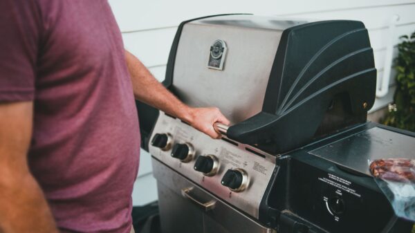 Best gas grill: a propane grill on a backyard patio