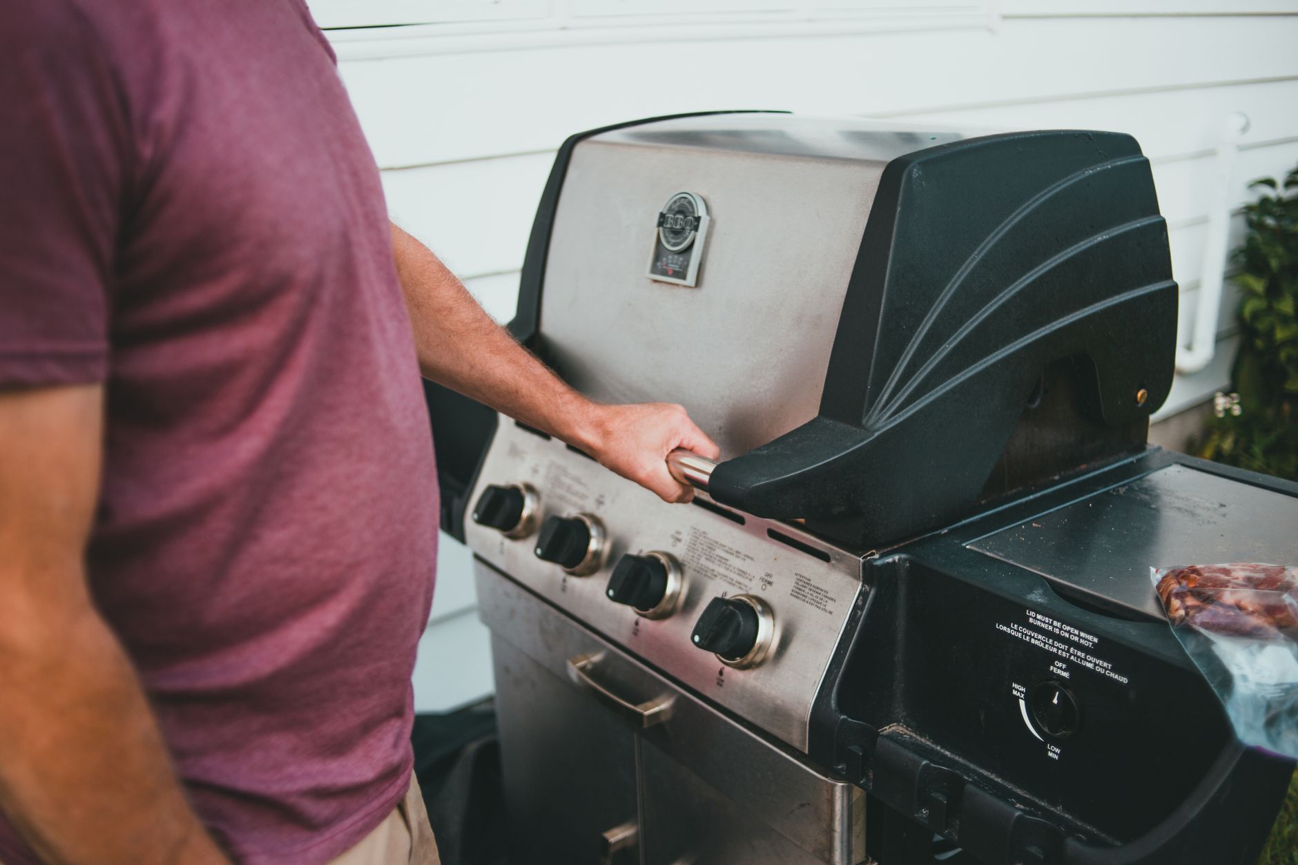 Best gas grill: a propane grill on a backyard patio