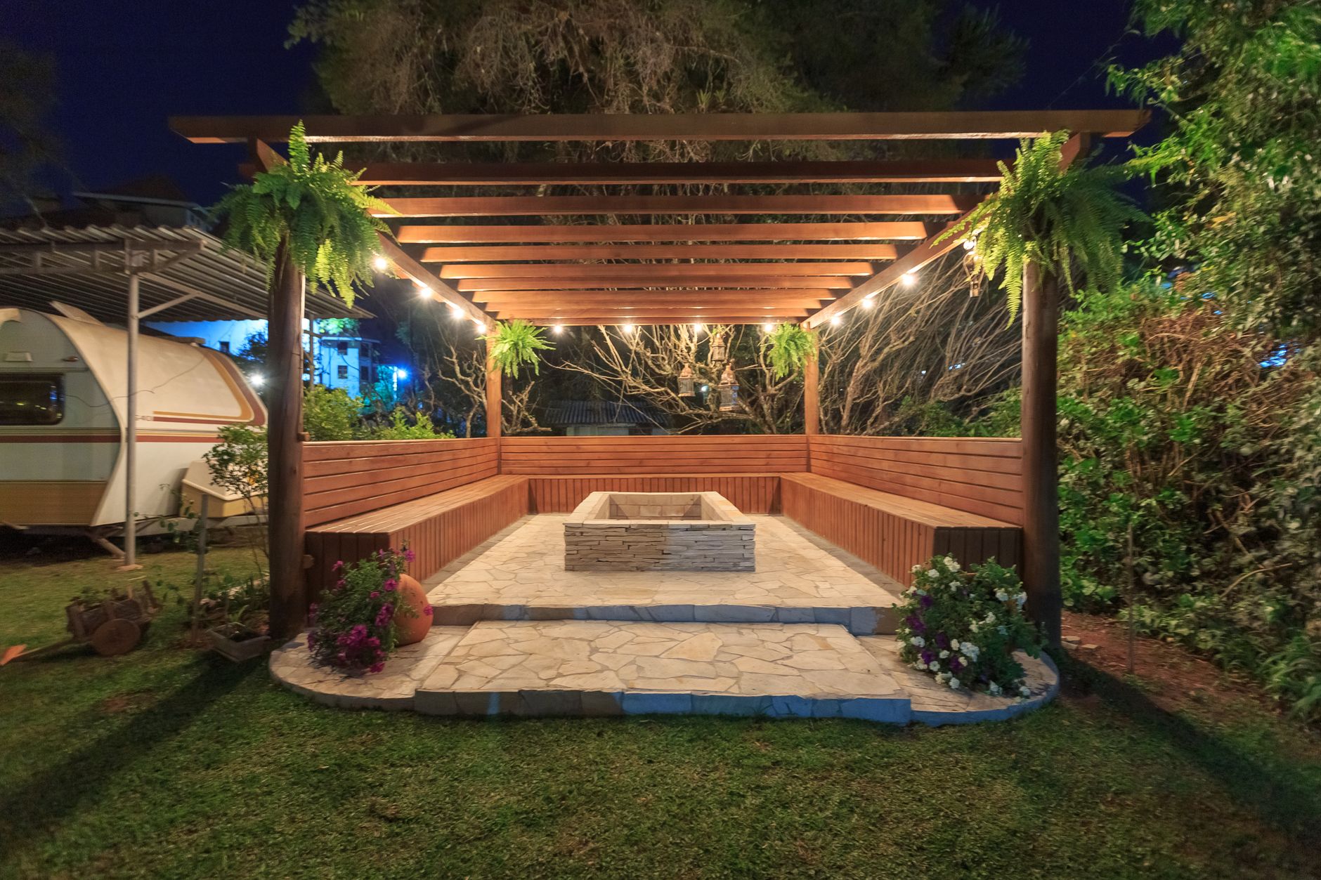 A covered pergola in a backyard garden
