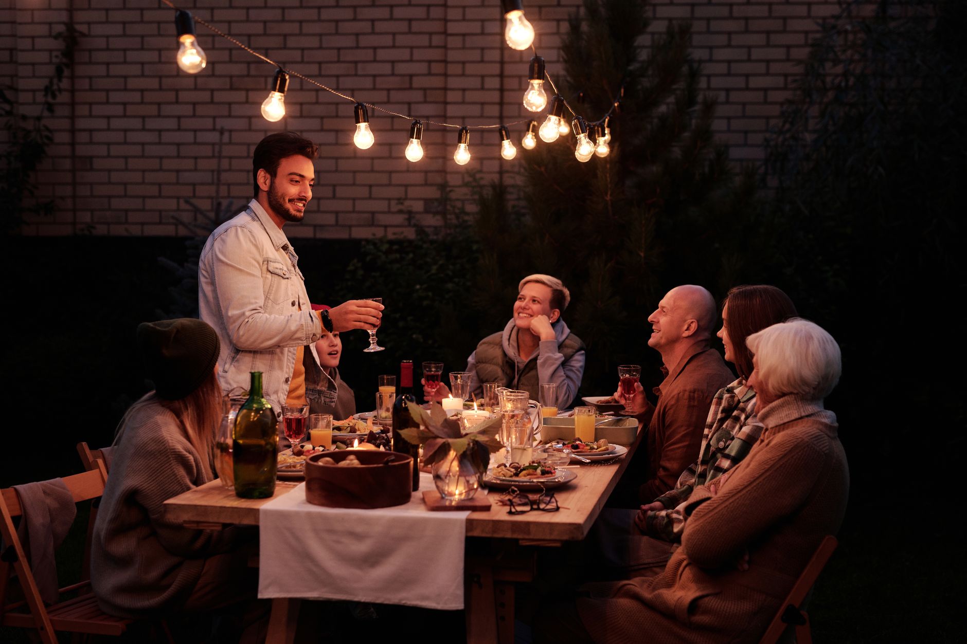 A table set for a meal on a backyard patio