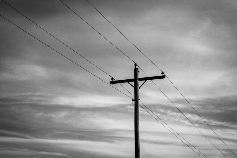 Best generator cord: power lines against a cloudy sky