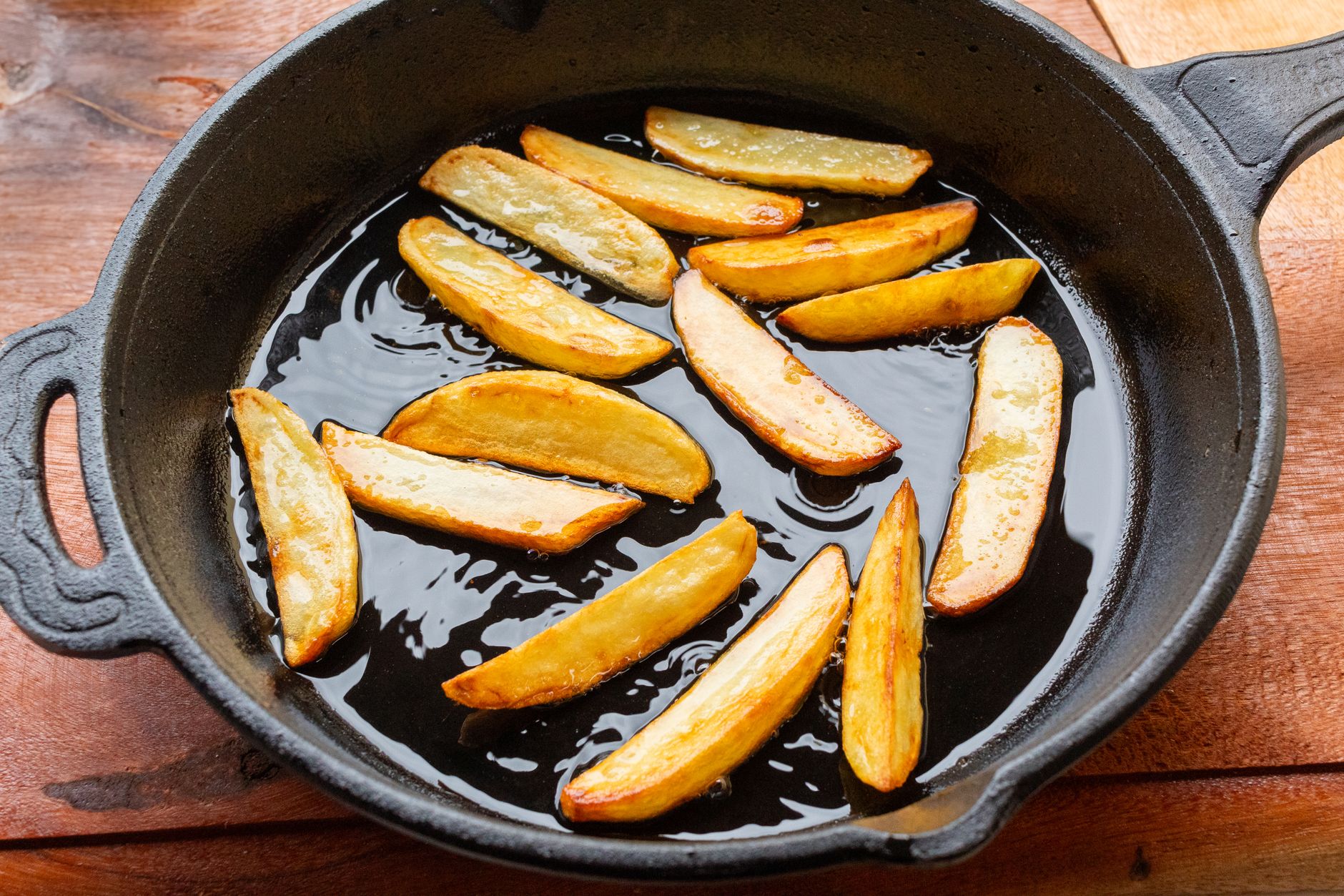 Potato wedges in a cast iron skillet