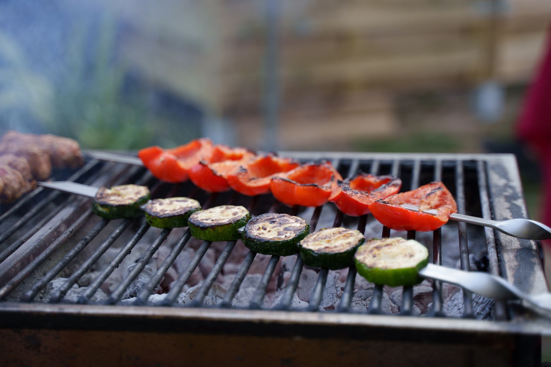 Vegetable skewers on a charcoal grill