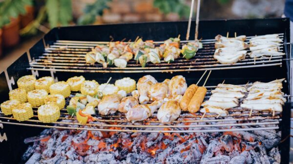 Best grill brush: skewers and corn on a charcoal grill