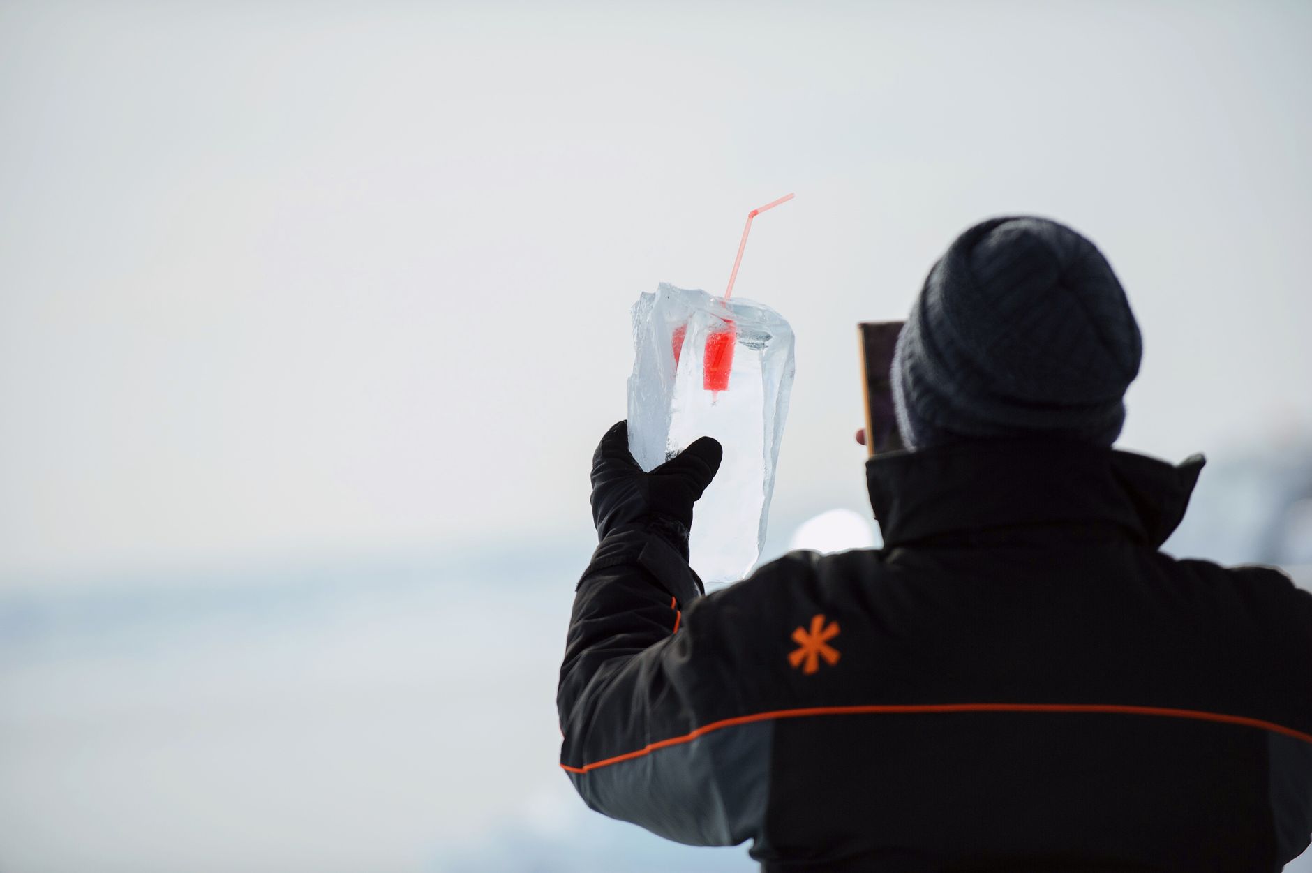 Cold hands wrapped around a warm drink in winter