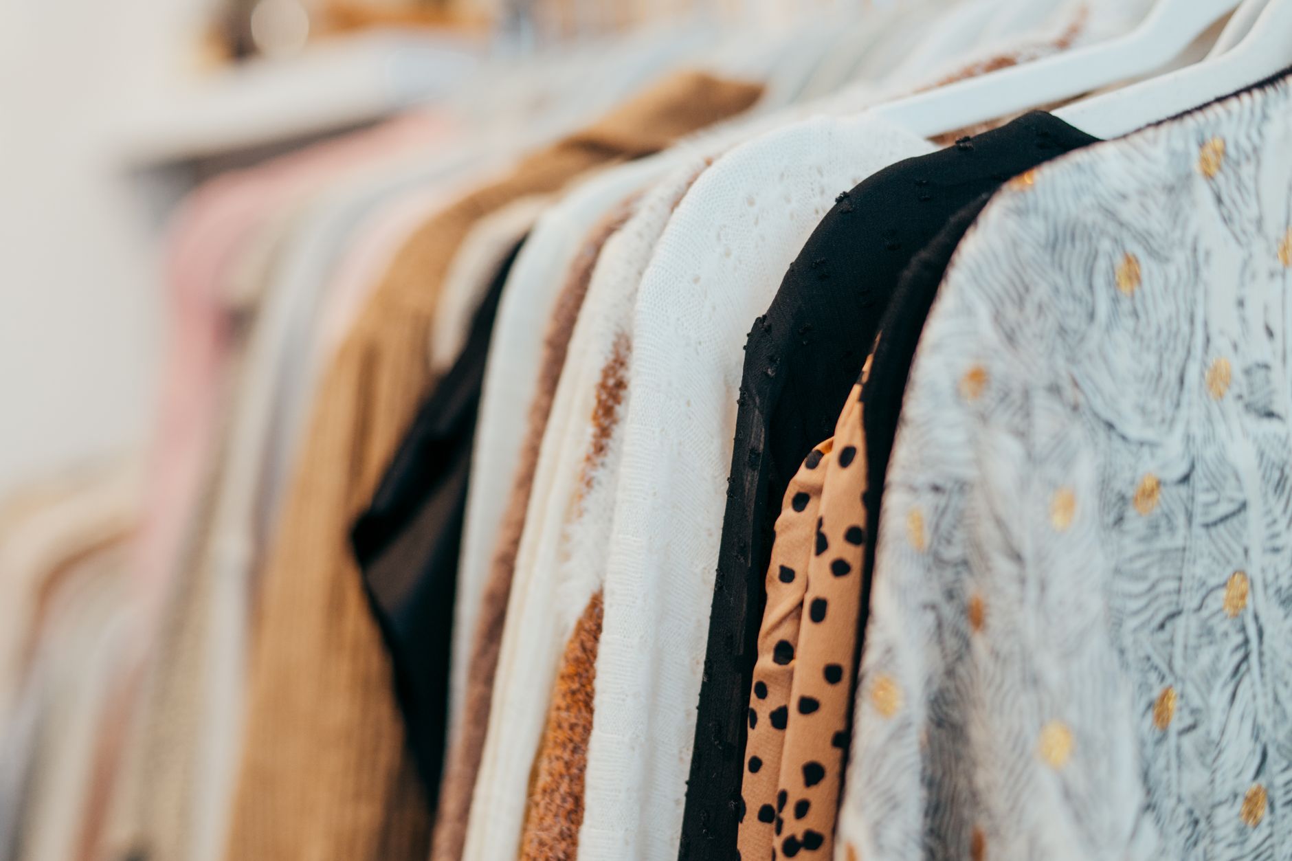 Best hangers: clothes hanging neatly on a closet rail