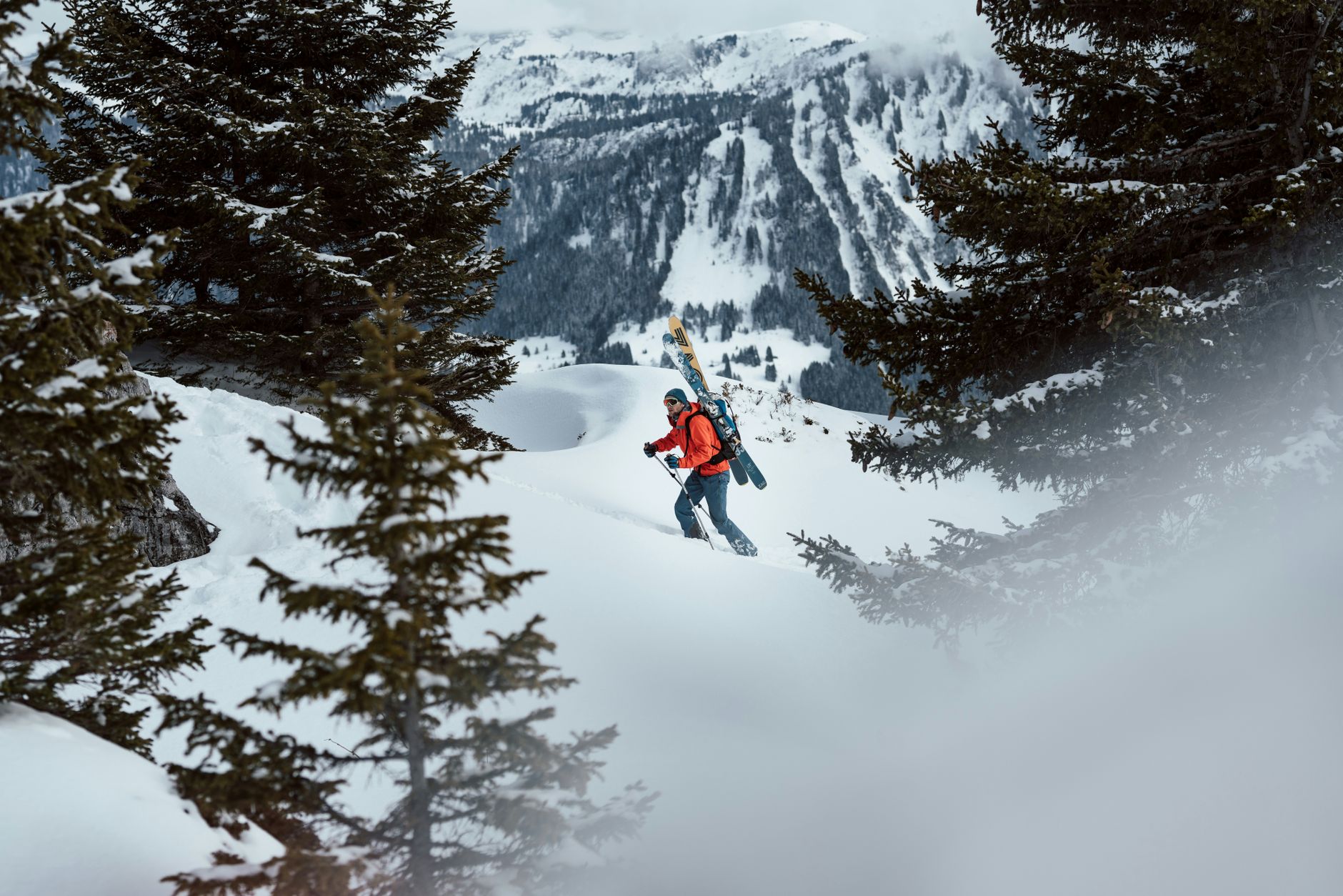 A skier on a snowy mountain slope