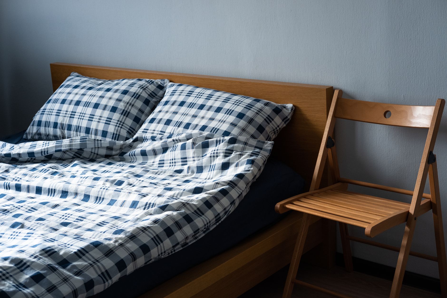 A soft folded blanket on a bed