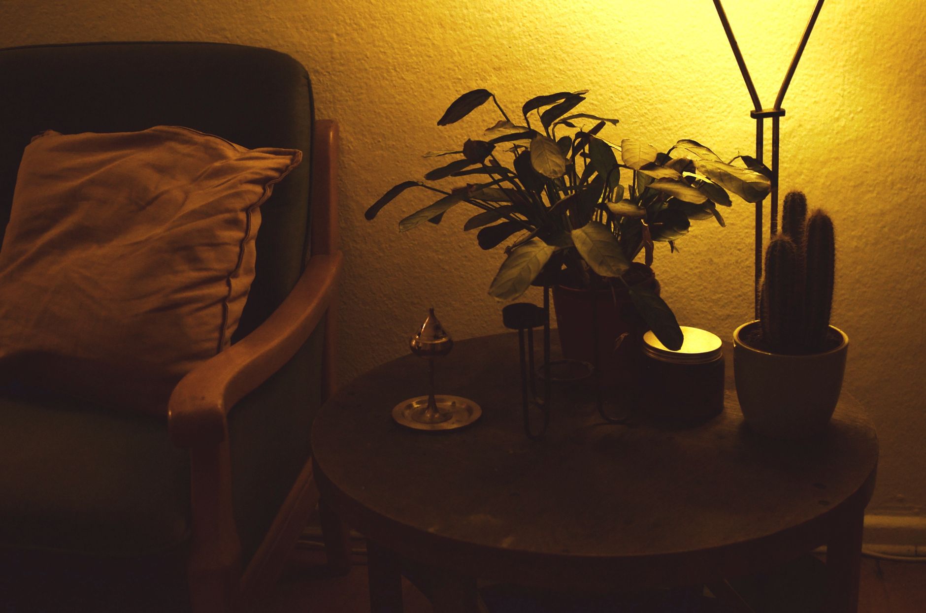 A living room lit by a lamp in the evening