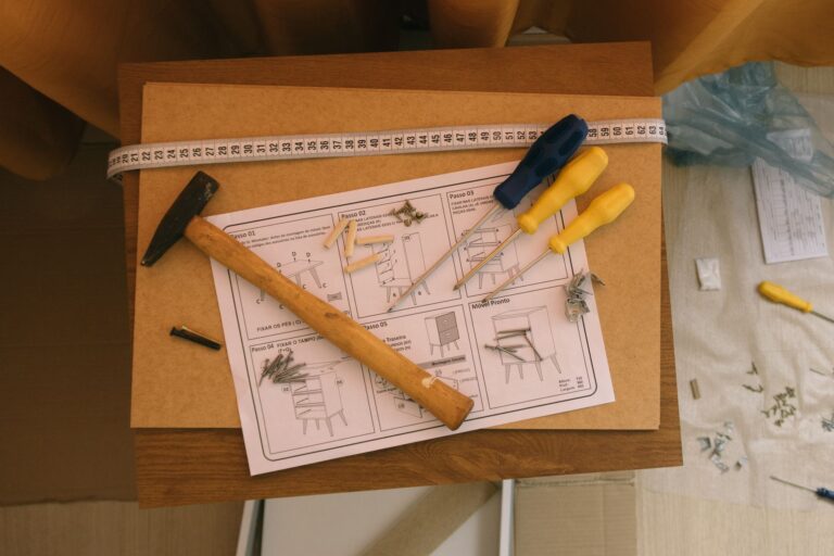 Best allen wrench set: a person assembling furniture at home with hand tools