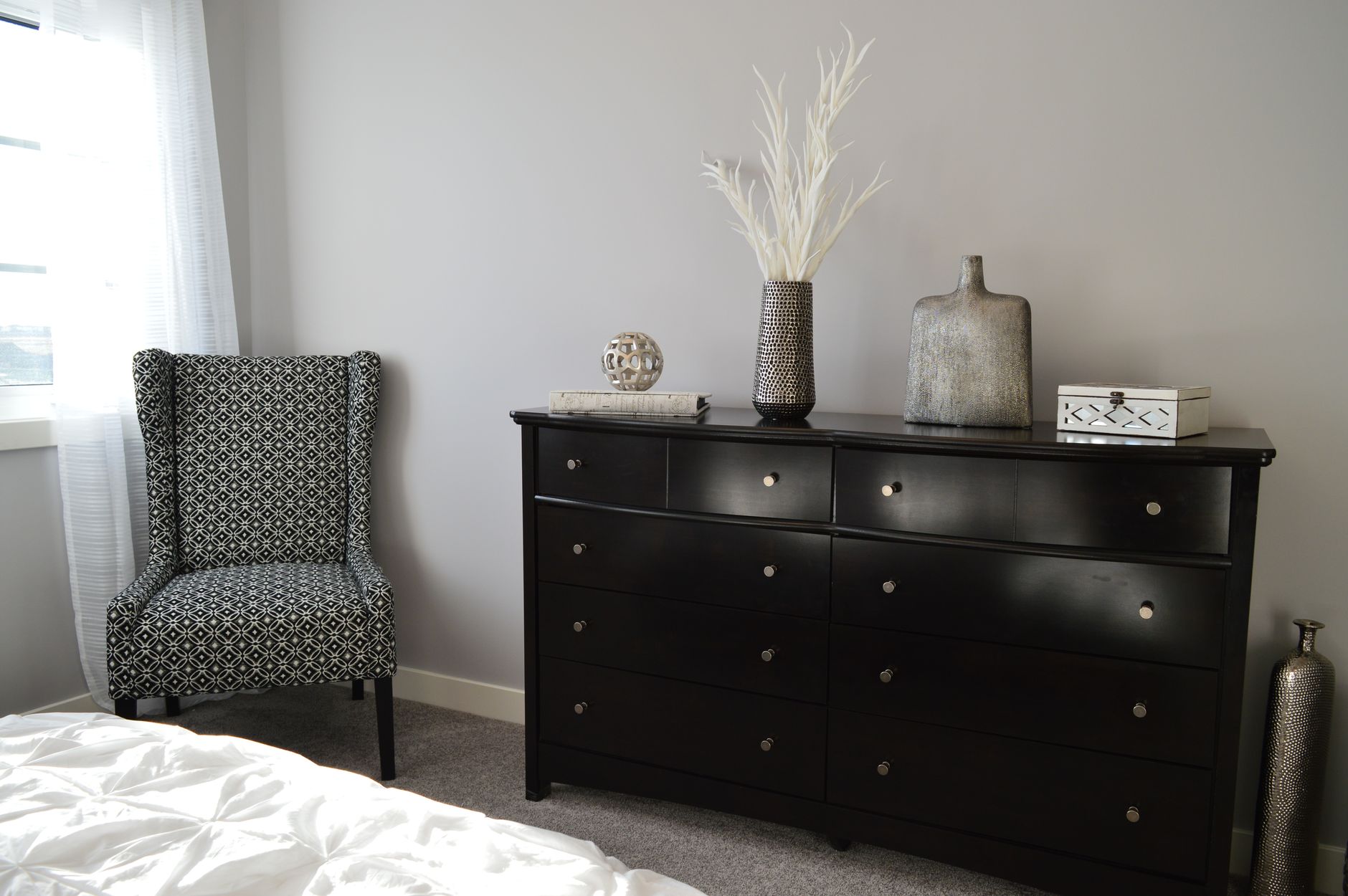 A dresser in a bedroom