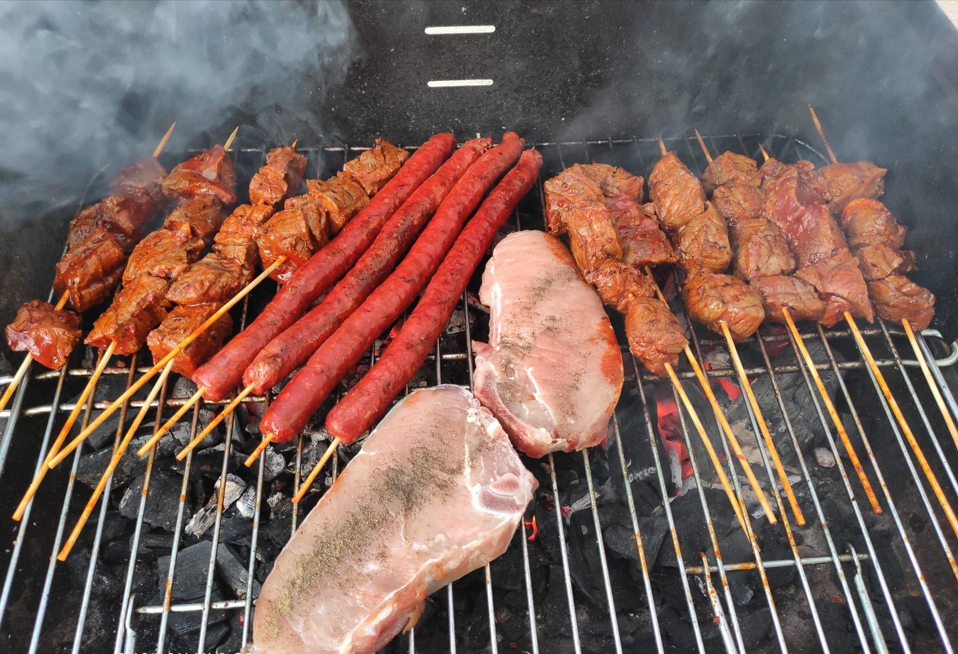 Best hibachi grill: skewers and meat on a charcoal grill