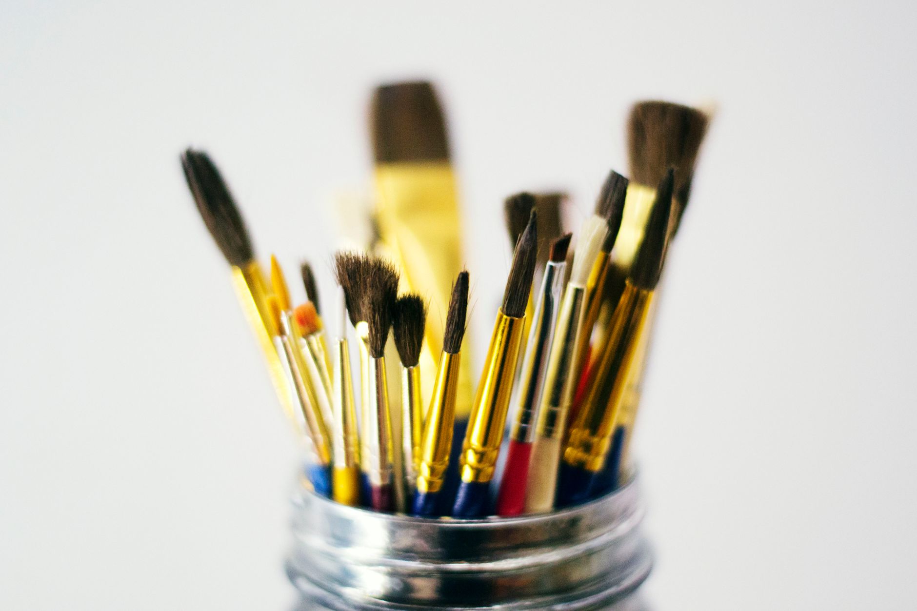 Paint brushes in a jar