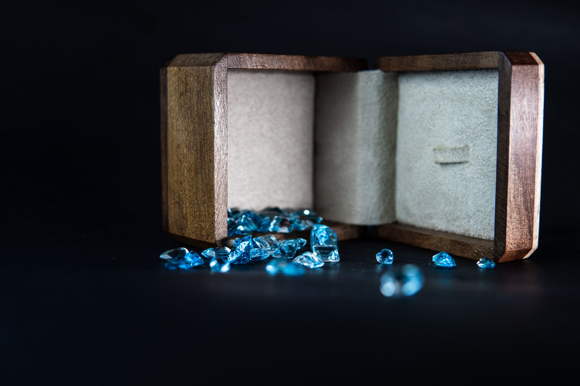 Blue gems by a wooden box