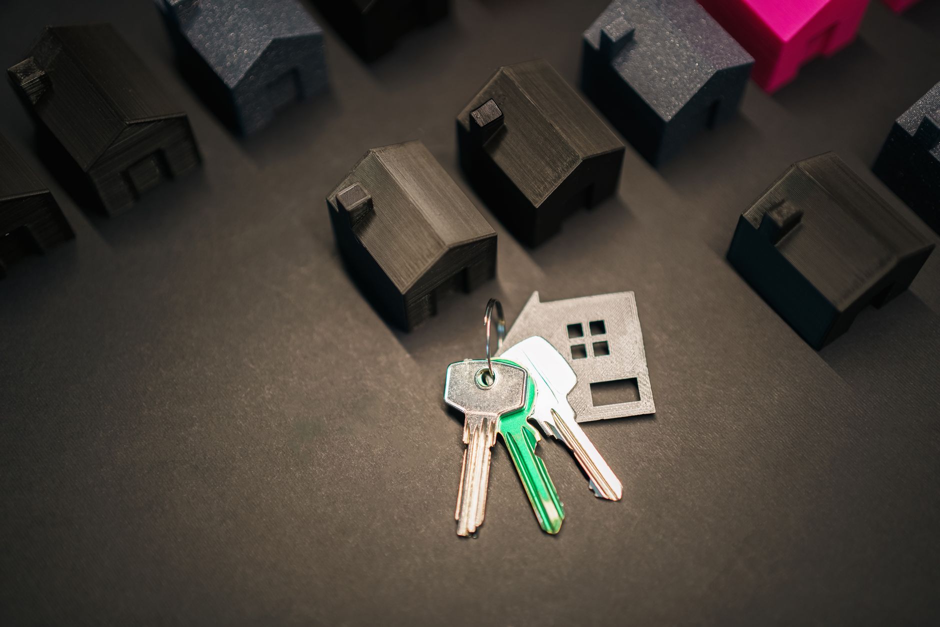 House keys beside model houses