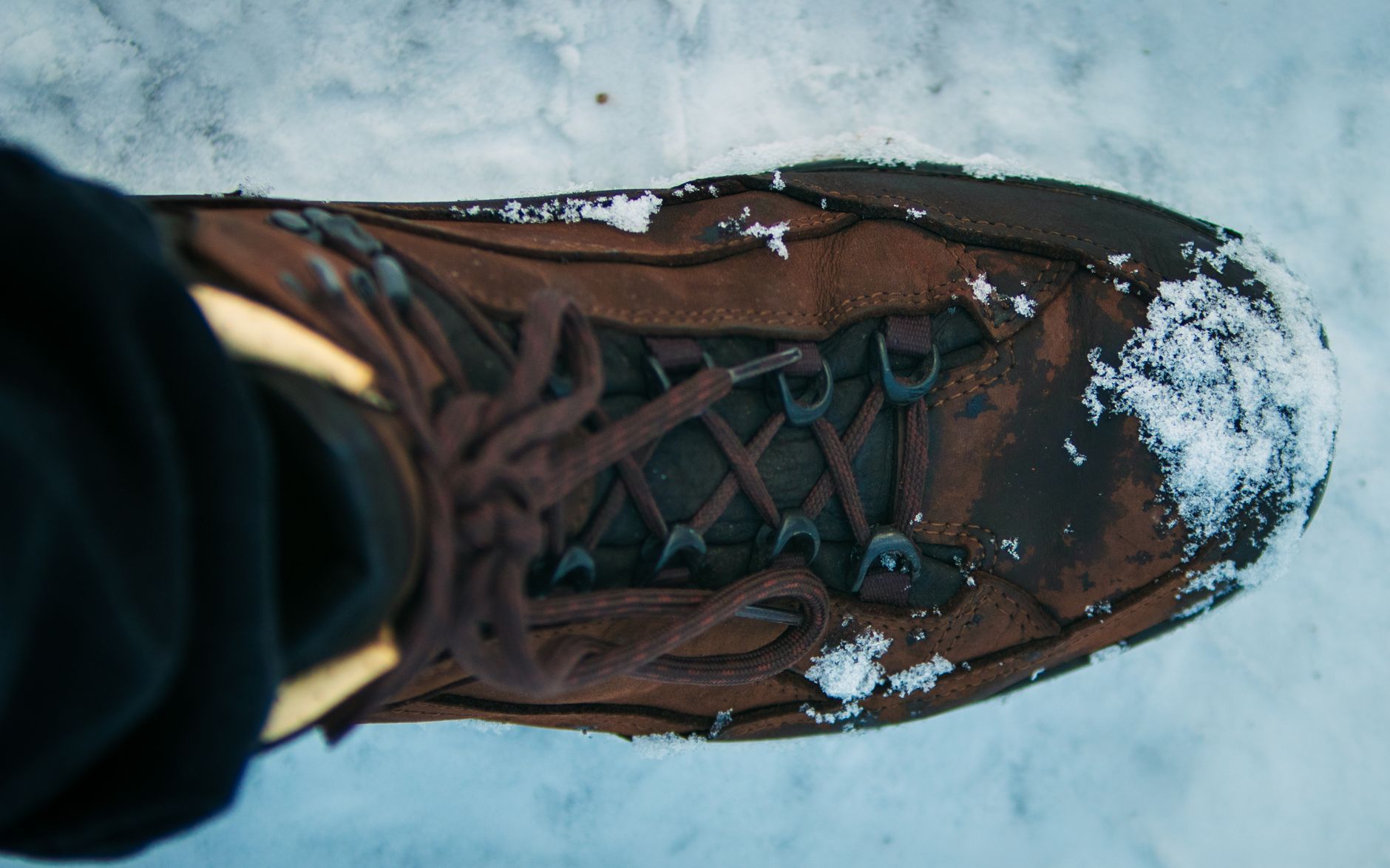 A boot standing in snow