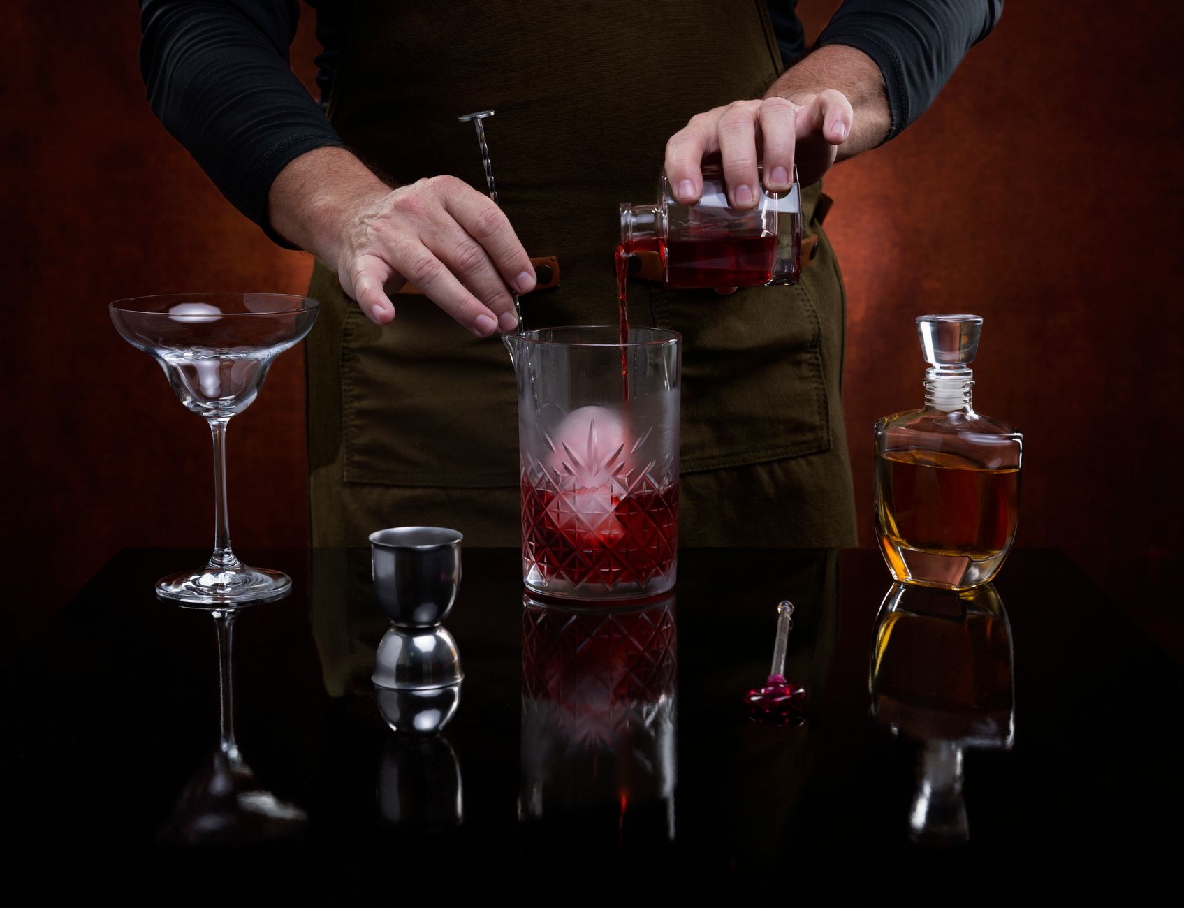 A large round ice ball in a glass