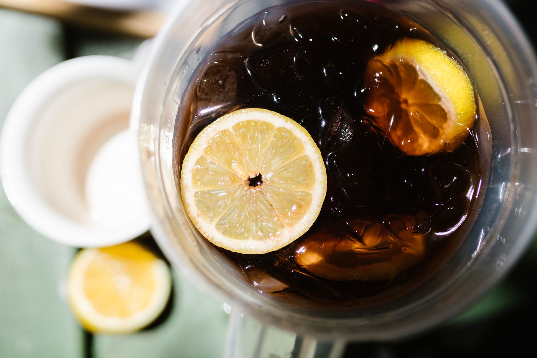 A pitcher of a cold drink with ice
