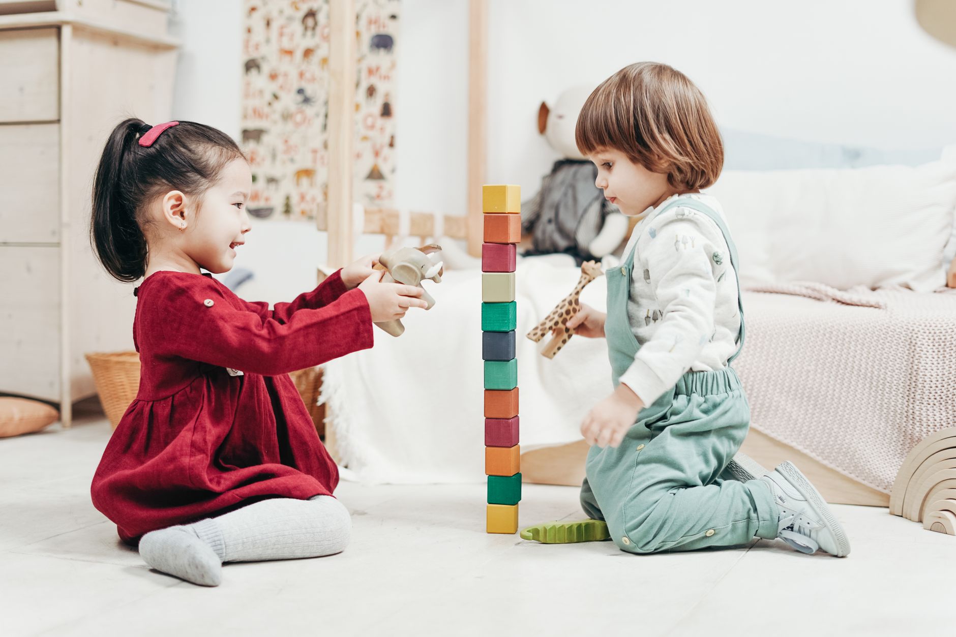 Two children playing with blocks