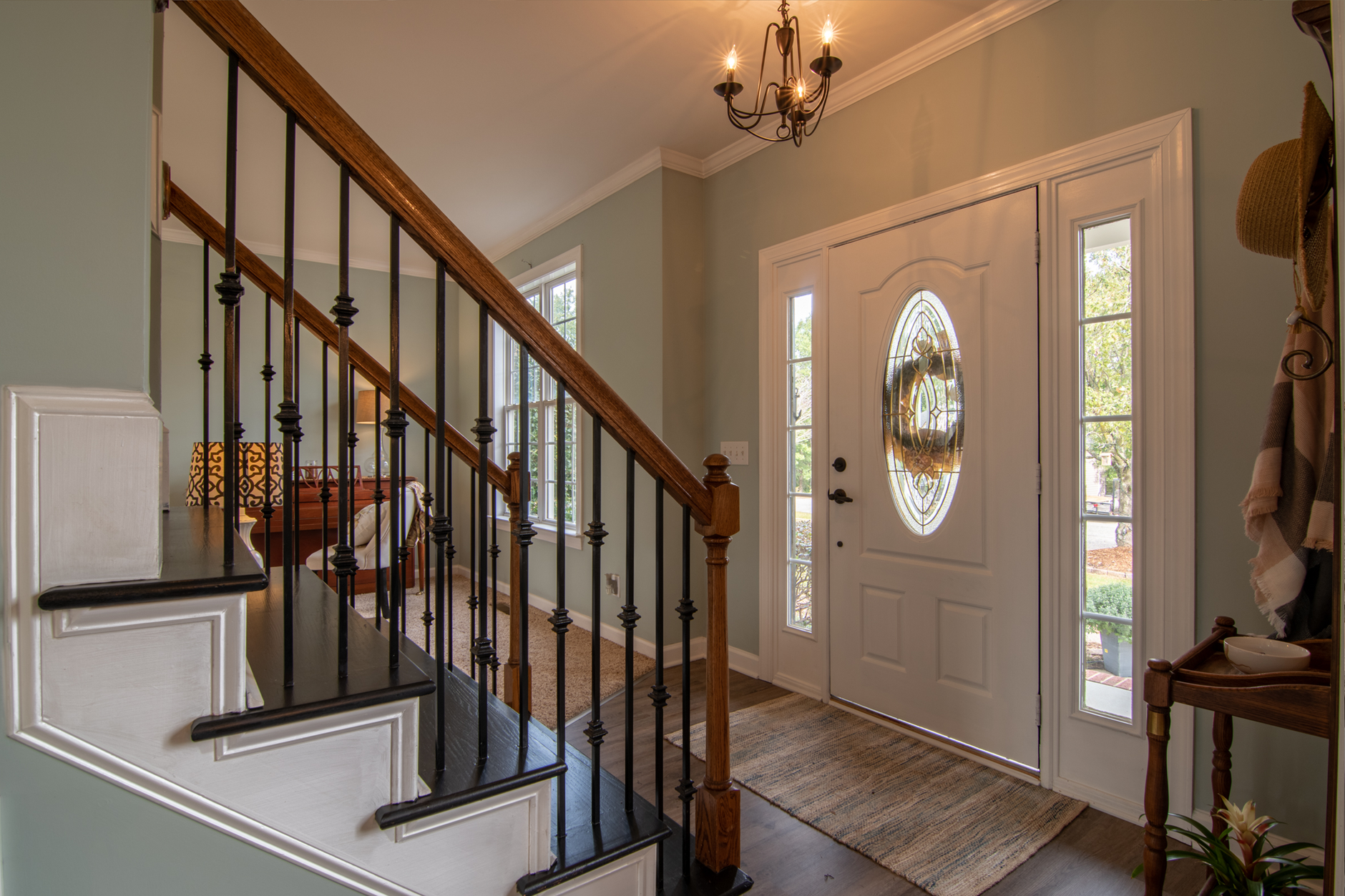 A front entry hall with a staircase