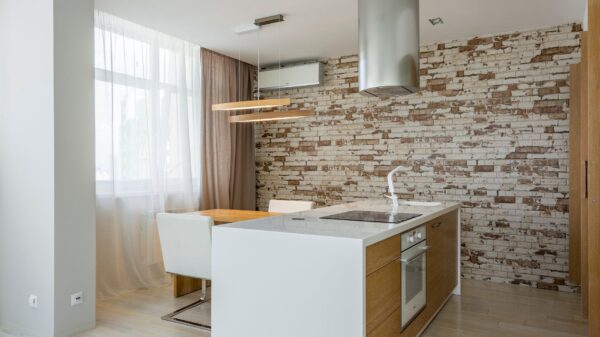 Best island range hood: a chimney hood over a white kitchen island