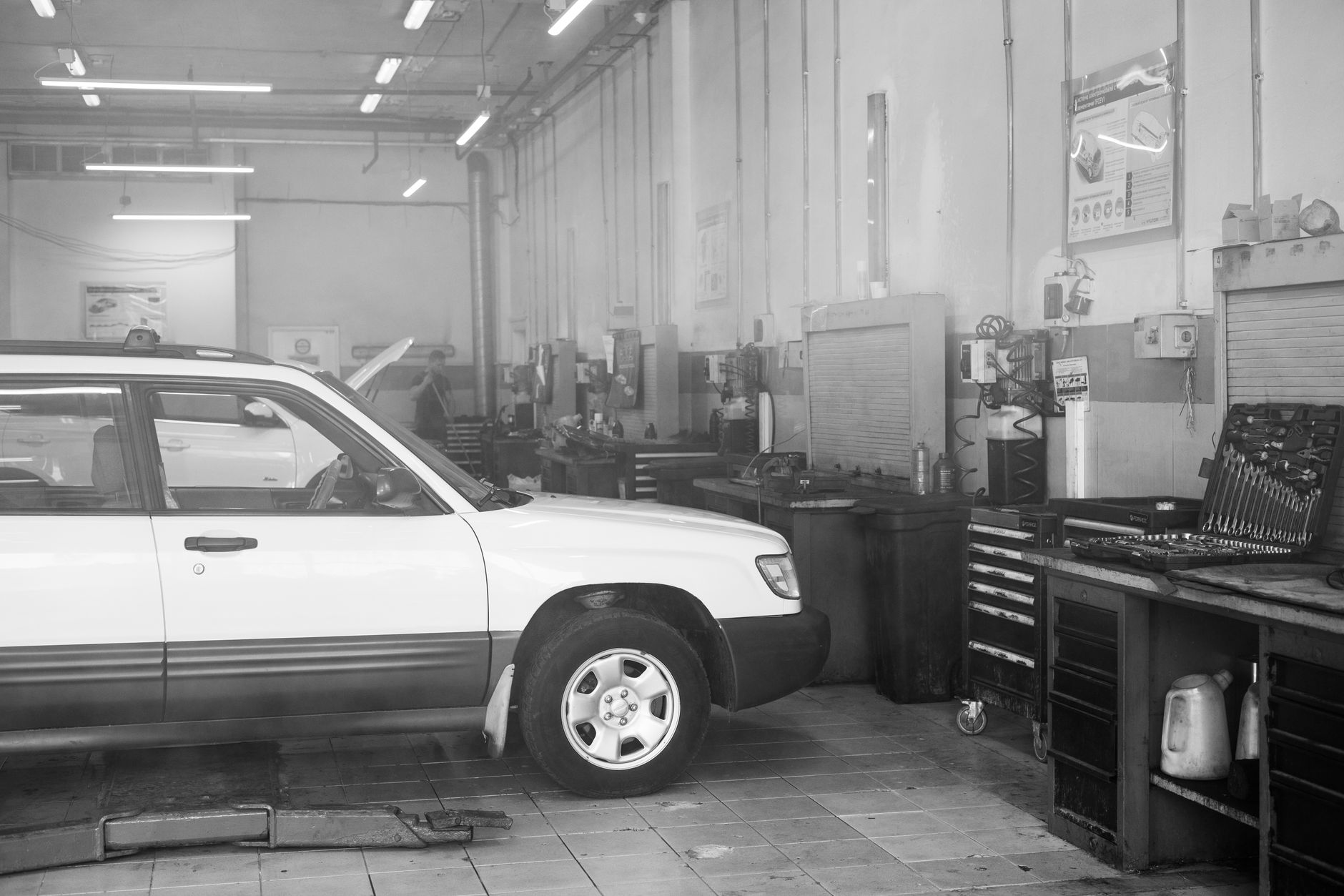 A car parked in a repair shop