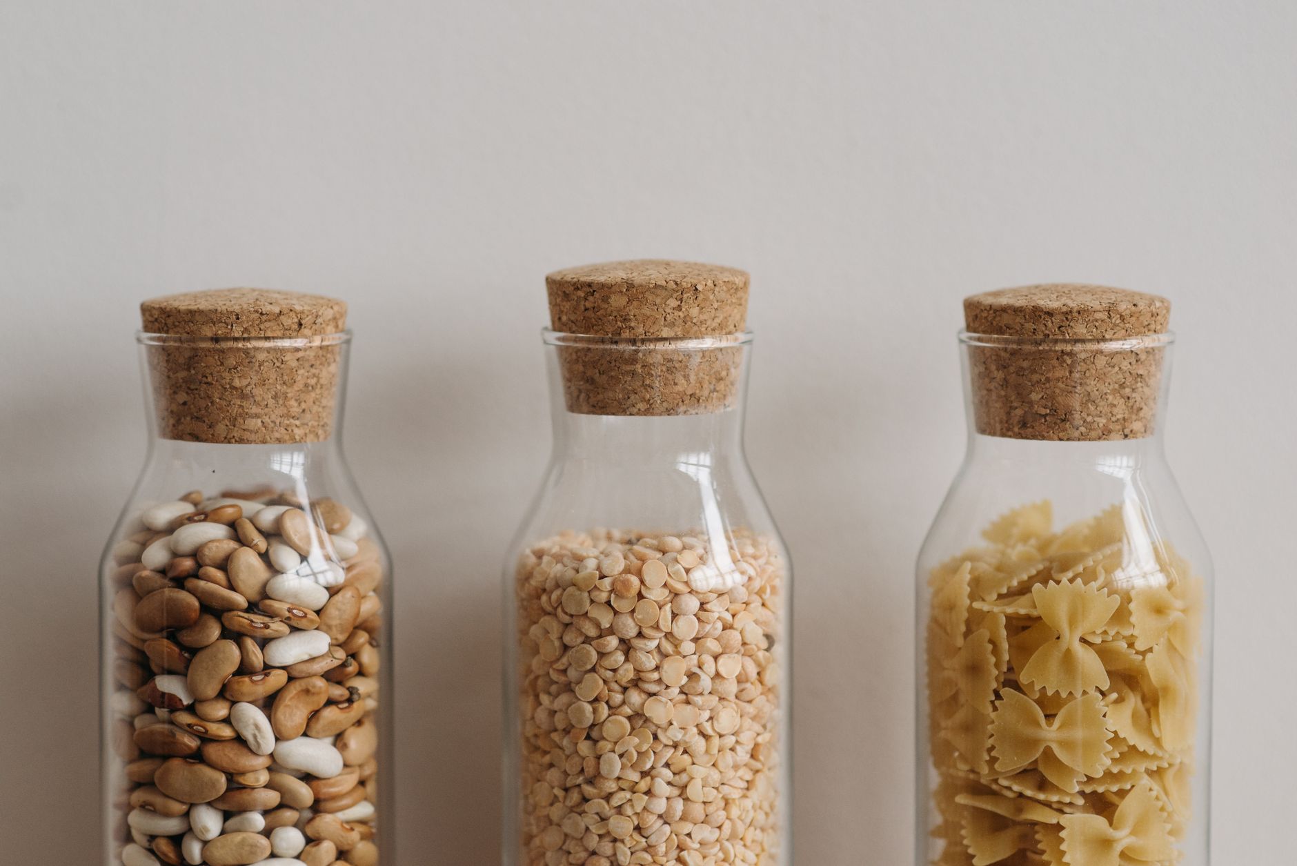 Beans, peas and pasta in glass jars