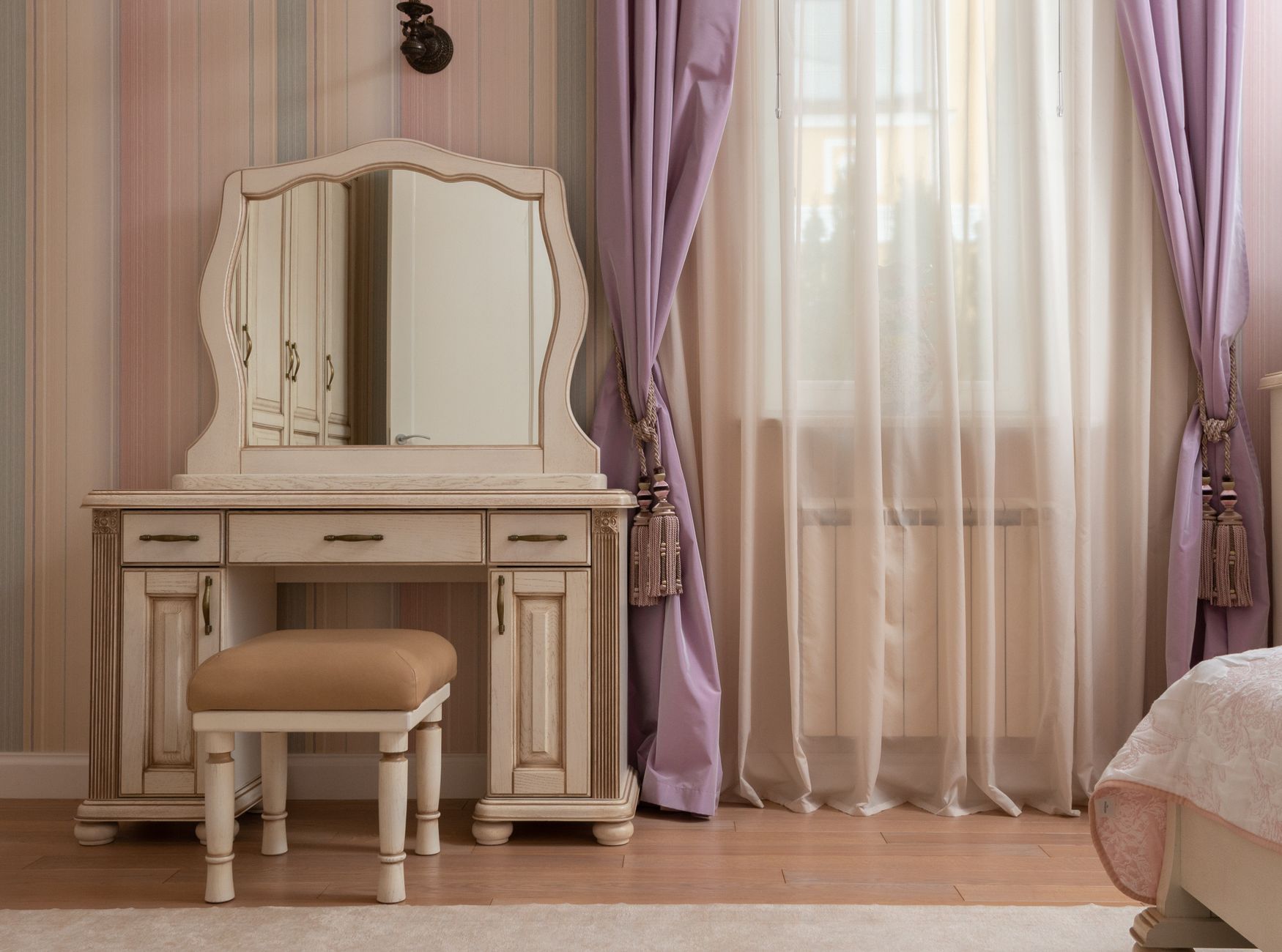 A vanity mirror in a bedroom