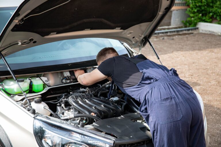 Best jumper cables: a car with its hood open in a driveway