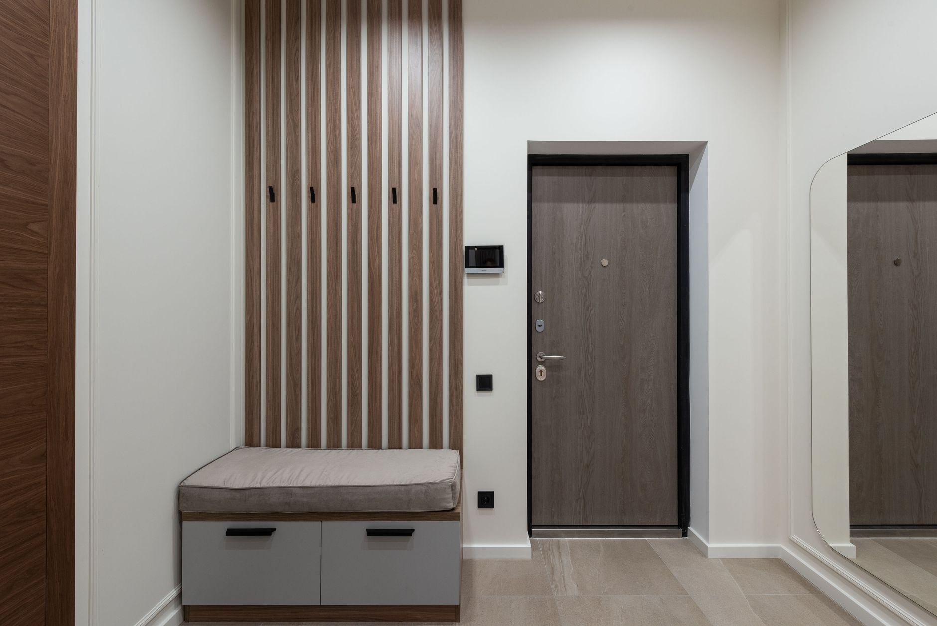 Hooks mounted on an entryway wall