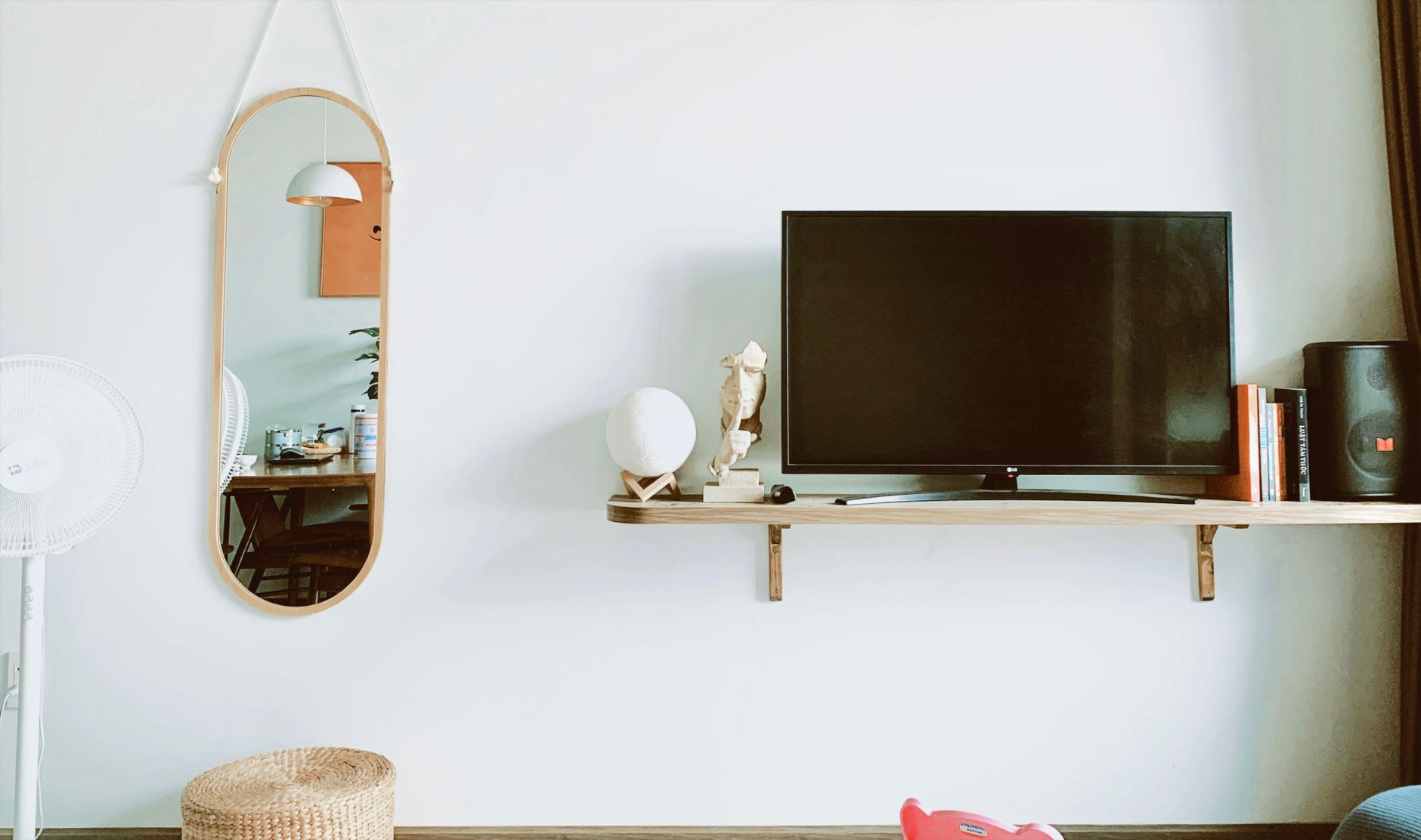 A small wooden shelf mounted on a wall
