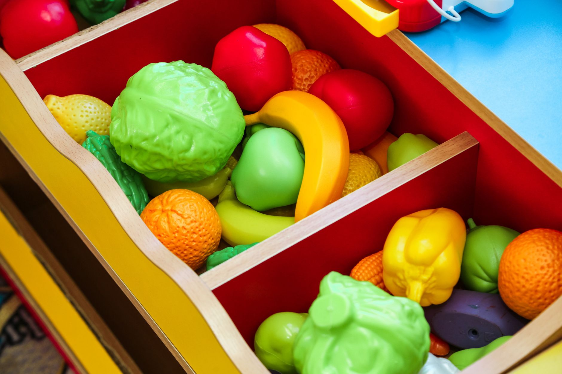 Toys and bins organized in a playroom