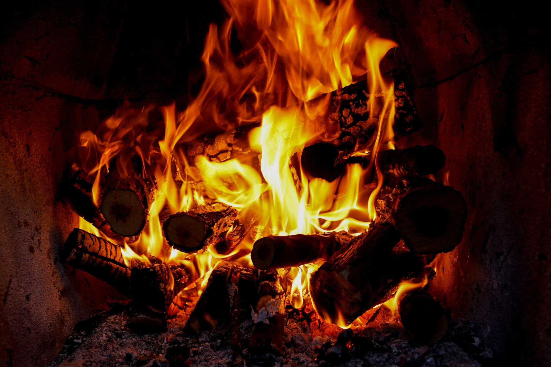 A fire burning in a home fireplace
