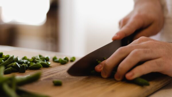 Best kitchen knife set: slicing green beans on a board