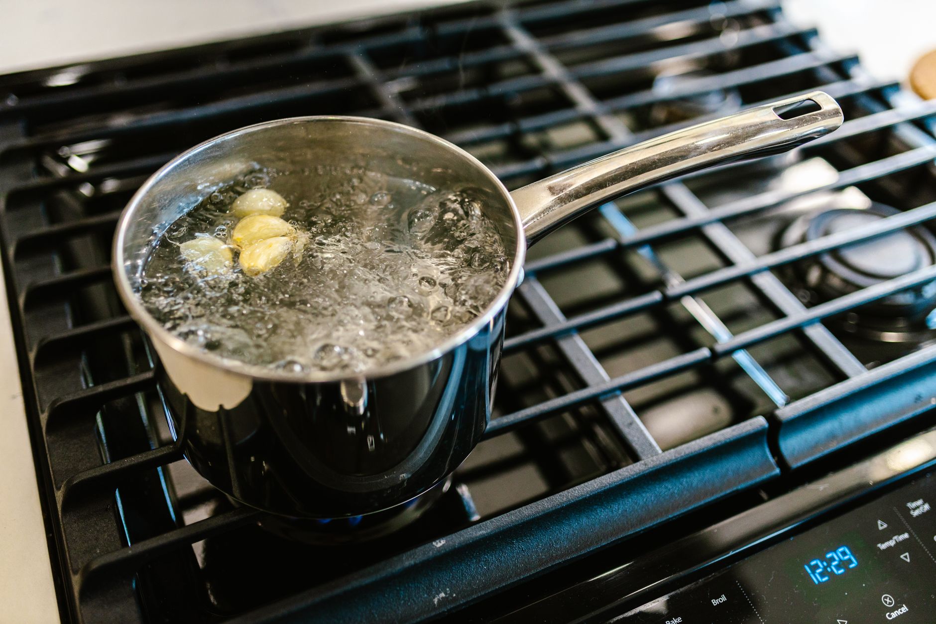 Potatoes boiling in a saucepan