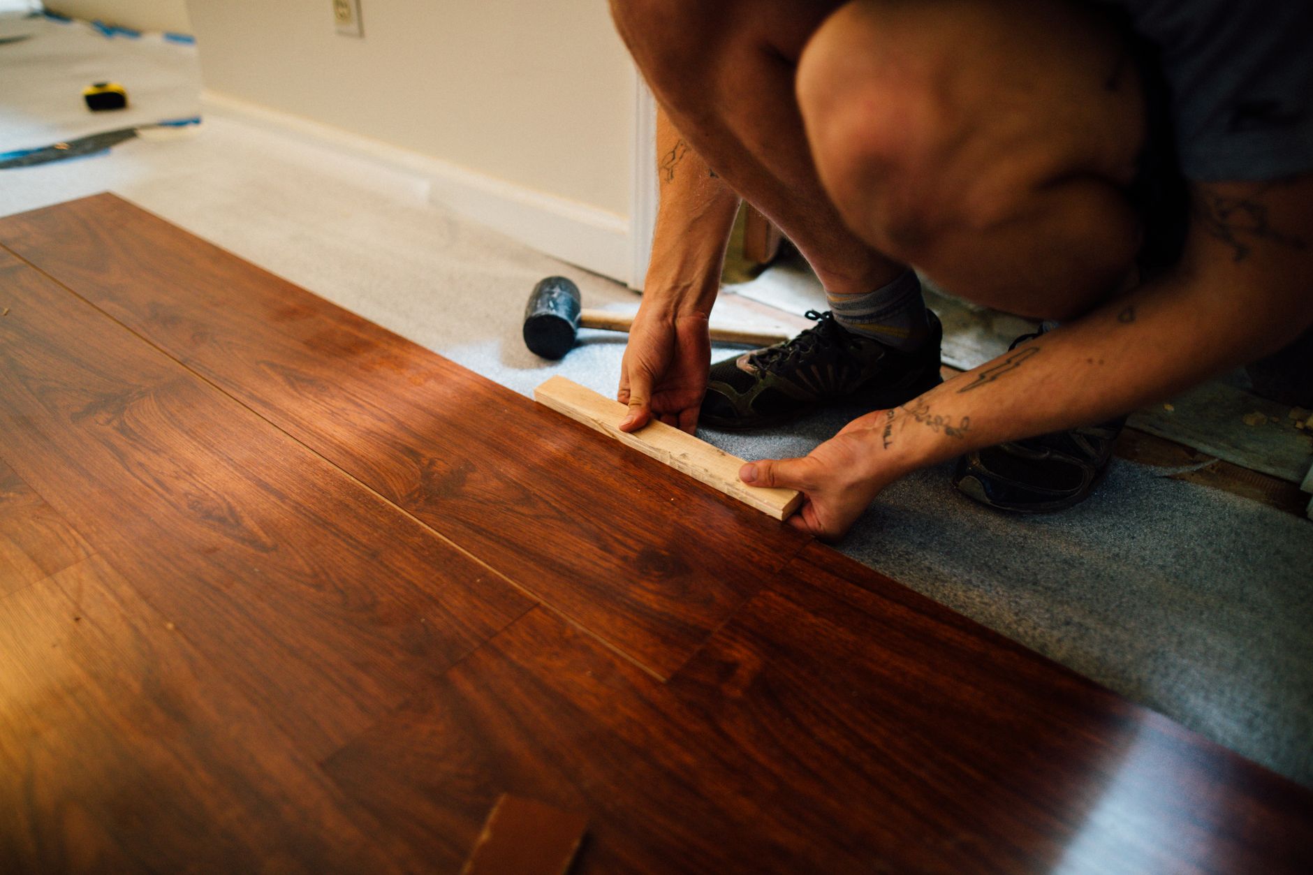 Best knee pads for work: kneeling to install a wood floor