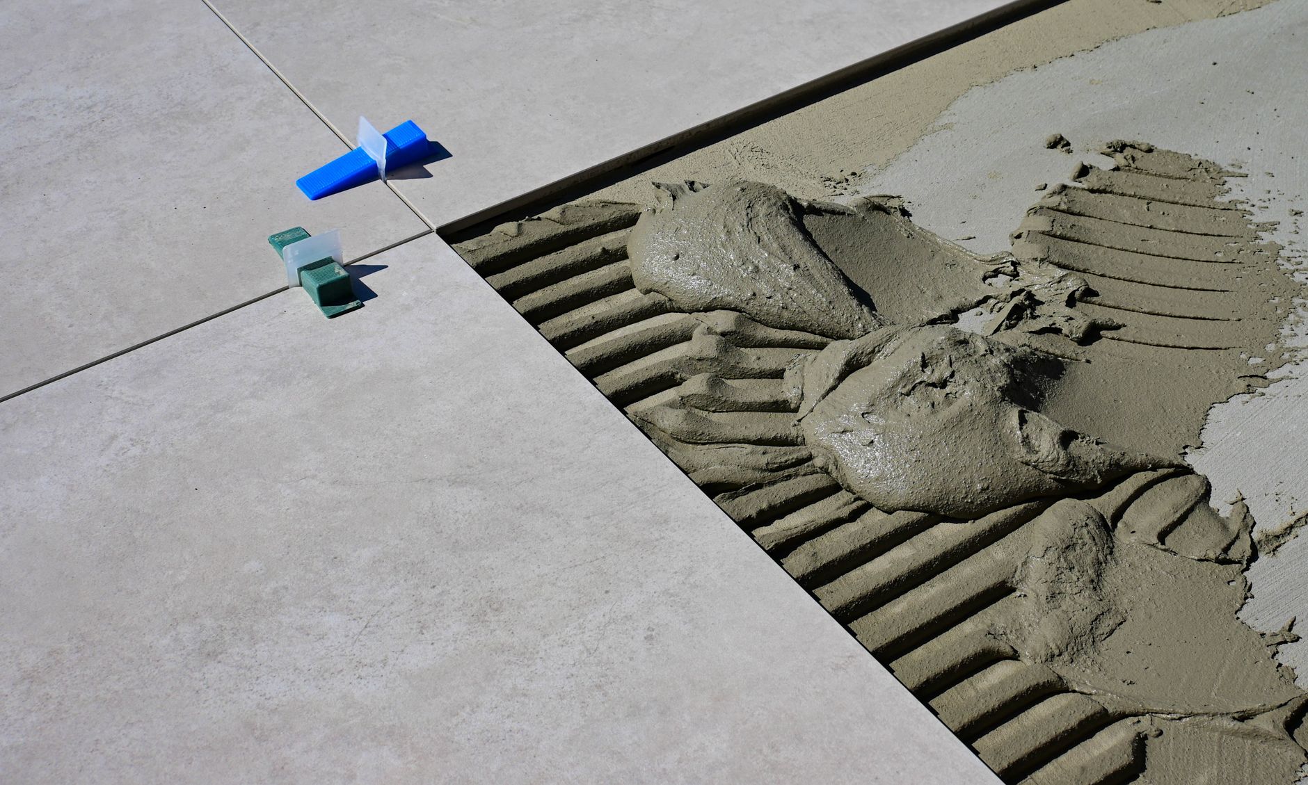 Floor tiles being set in mortar