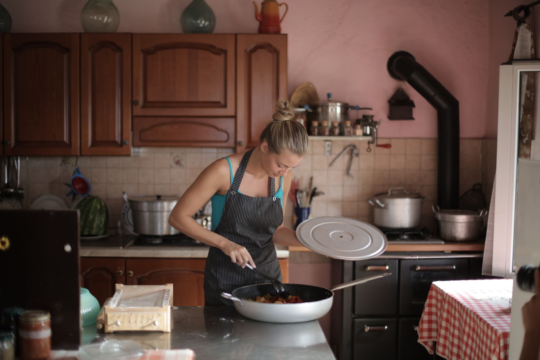 A woman cooking in a home kitchen