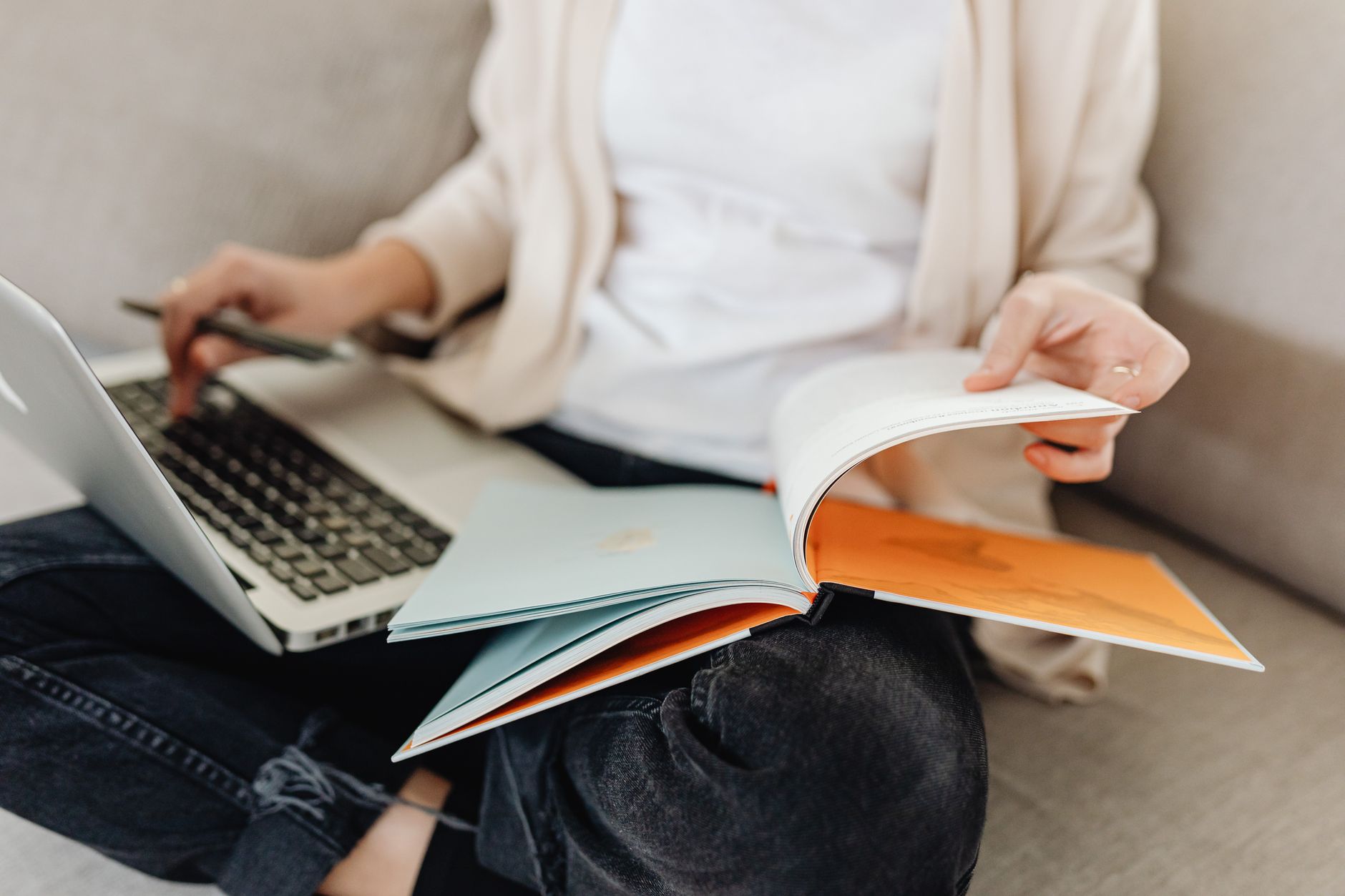 Best lap desk: a person working on a laptop while sitting on a couch