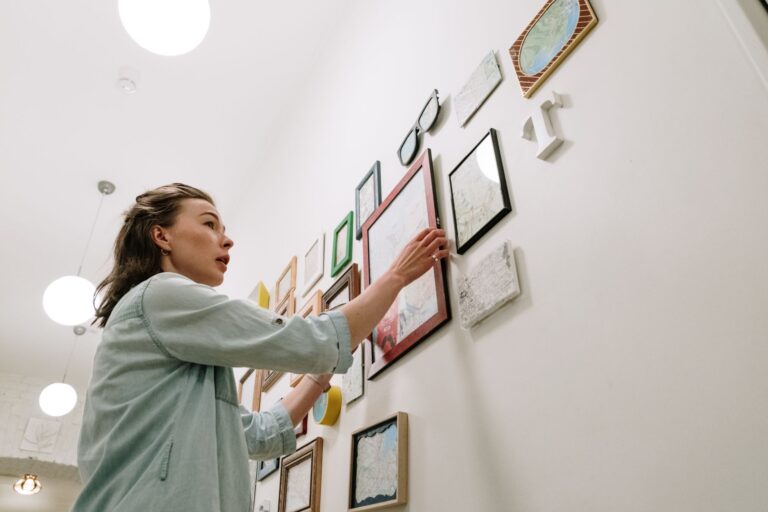 Best laser level: a neat row of picture frames on a living room wall